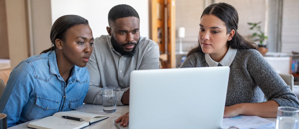 Couple viewing options with a financial advisor