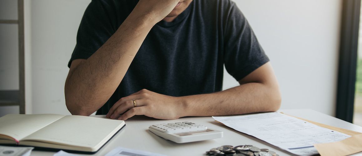 Man looking over his finances.